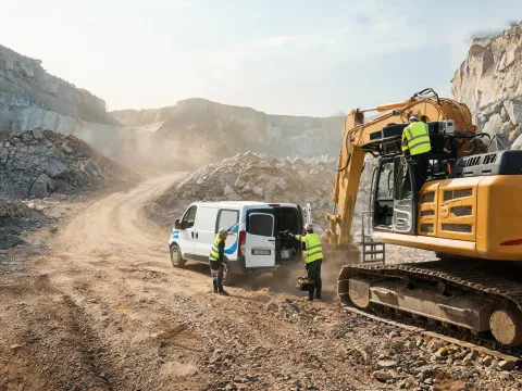 Field service van crew on quarry haul road