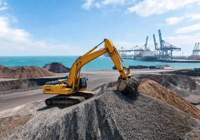 Port stockyard reclaim excavator